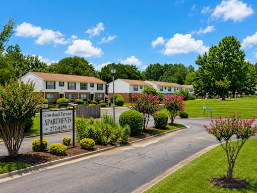 Groveland Terrace Apartments is a residential complex with a well-maintained lawn and landscaping.