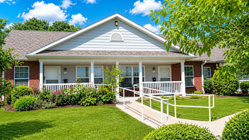 A house with a white porch and a white railing.