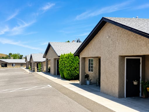 A parking lot with a building in the background.
