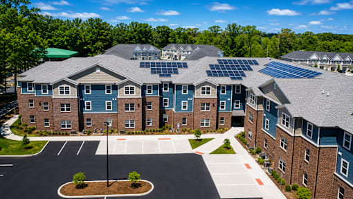 A large building with solar panels on the roof.