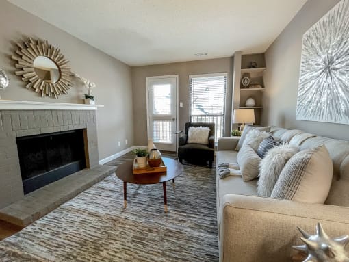 an open living room with a fireplace and a couch