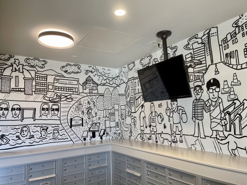 a mural on the wall of a room with drawers
