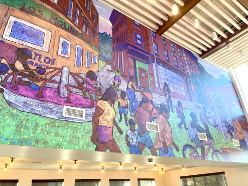 a mural on the wall of the lobby of a building