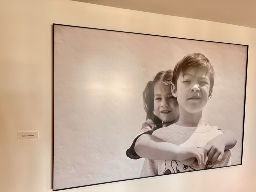 a picture of a girl and a boy with their arms