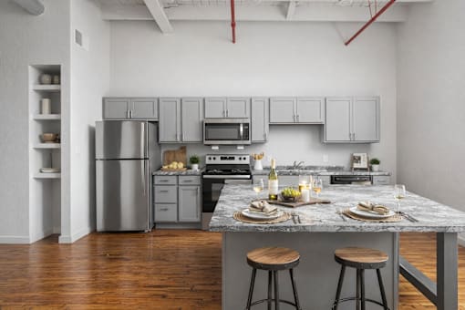 A kitchen with a white stove and white oven.