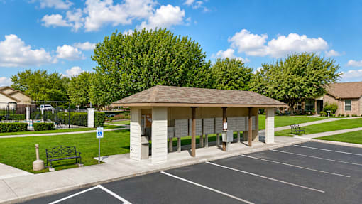 A parking lot with a building in the background.