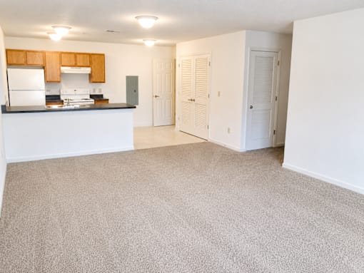 A kitchen with white appliances and a countertop.