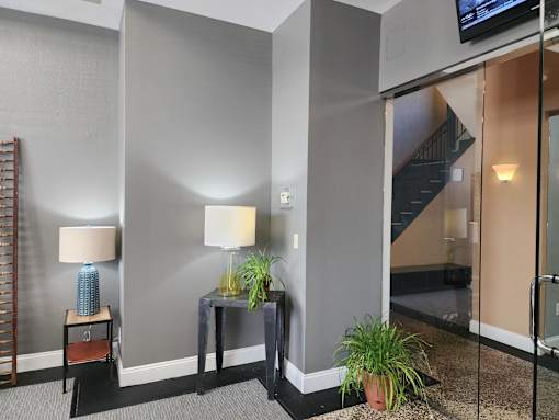 Leasing center lobby and a staircase in the background.