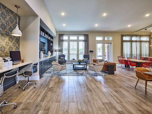 A modern living room with a wooden floor and furniture.