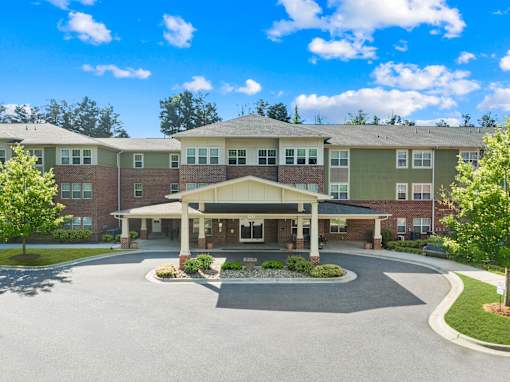 A large building with a covered walkway in front of it.