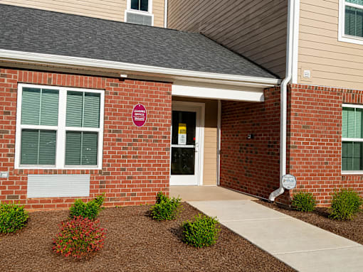 A brick building with a sign that says "BAN" on it.