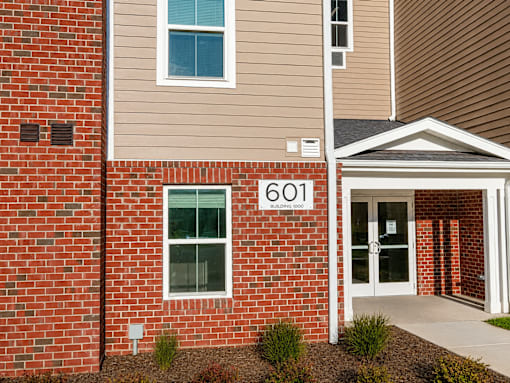 A brick building with the number 601 on it.
