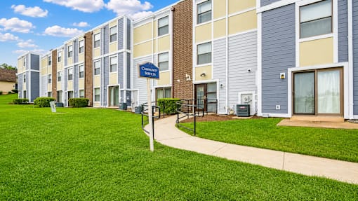 A row of apartment buildings with a sign that says "Twinbrook".