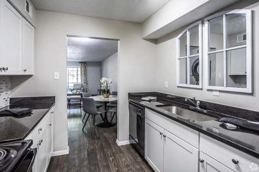 a kitchen and dining area in a 555 waverly unit at Azure Place Apartments, Memphis, 38118
