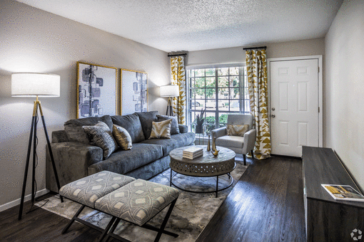 a living room with a large couch at Azure Place Apartments, Memphis, TN