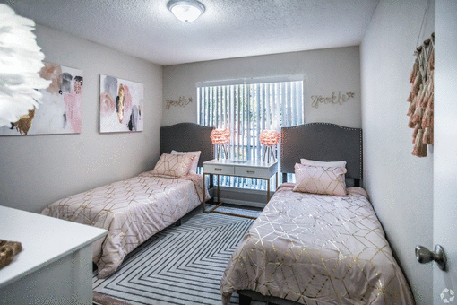 a bedroom with two beds and a window at Azure Place Apartments, Tennessee