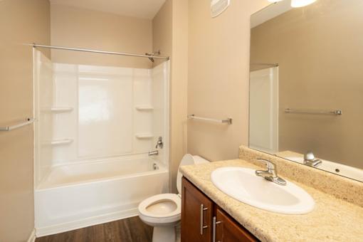 a bathroom with a sink toilet and a shower