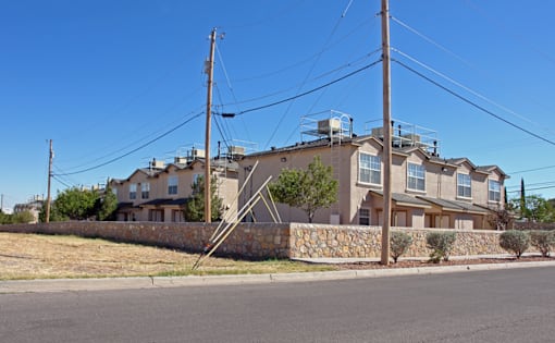 a row of houses on the side of a street