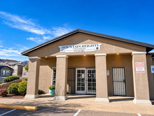 The front of a building with the name "Mountain Heights" on it.