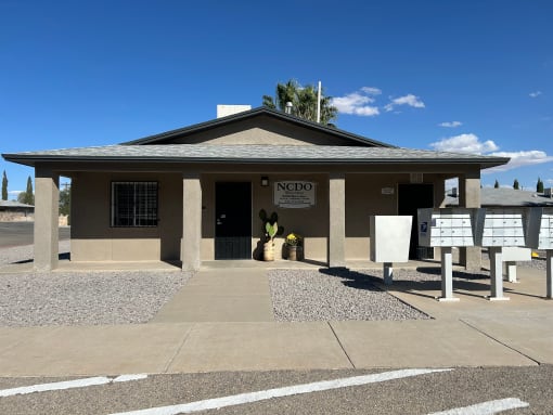 a small building with a sign in front of it