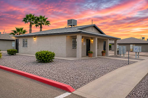 A house with a red curb in front of it.