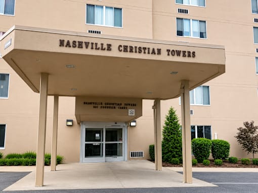 The front of the Naseville Christian Towers building is shown.
