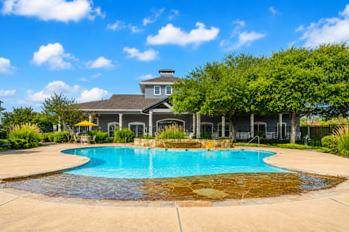 A house with a pool in the backyard.