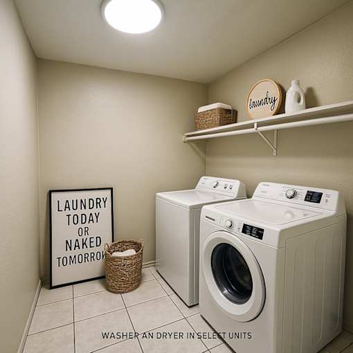 Laundry room with washers and dryers and a sign that says laundry today or naked tomorrow.