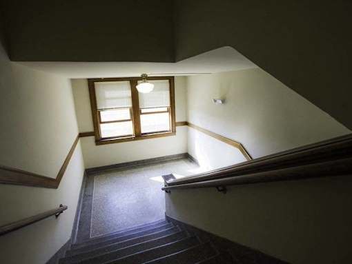 A staircase with a window above it.