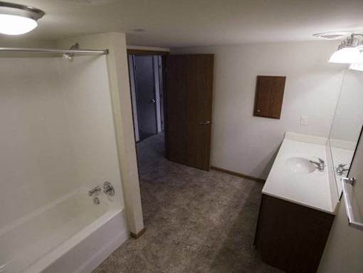 A small bathroom with a sink, toilet, and bathtub.