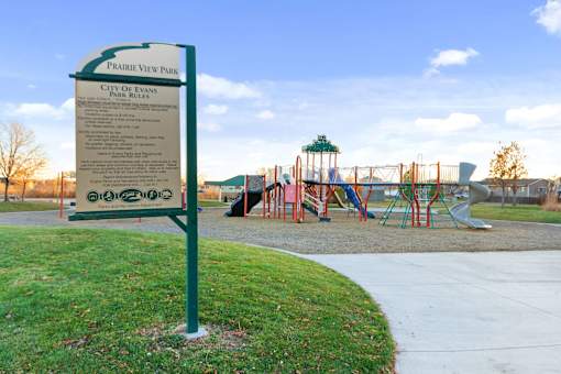 A sign in a park lists the rules for the park.
