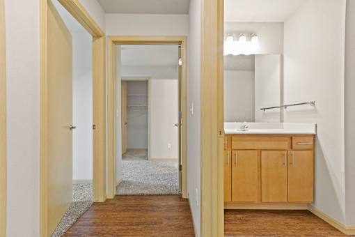 A bathroom with a sink and a mirror.