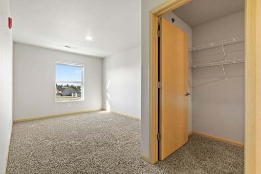 A room with a door and a window.