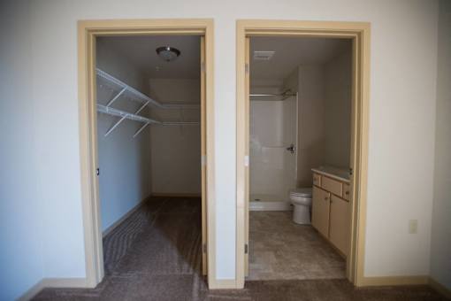A room with a toilet and sink in it.