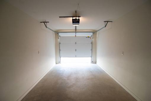 A long hallway with a door at the end.