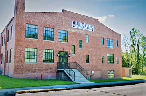 A red brick building with the words "Blue Bell" on the top.
