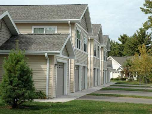 A row of houses with similar architecture and design.