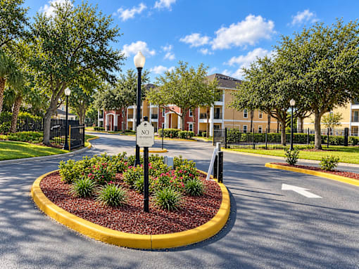 A roundabout with a stop sign in the middle of it.