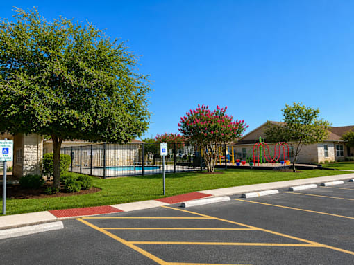 A parking lot with a red and yellow striped curb.