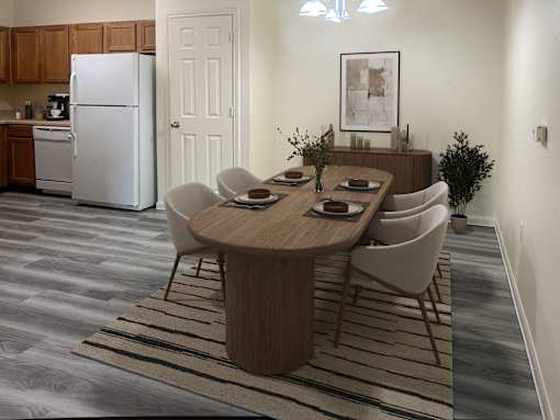 A modern dining room with a wooden table and chairs.