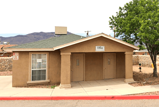 a brown building with a sign on the front of it
