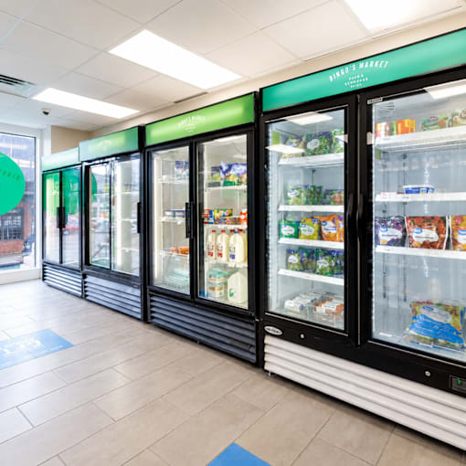 A row of refrigerators in a store.