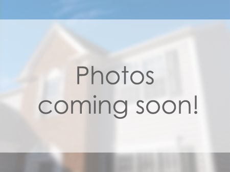 A house with a sign that says "Photos coming soon!"