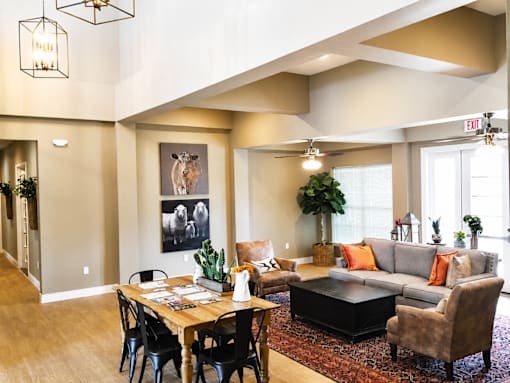 A living room with a grey couch and a coffee table.