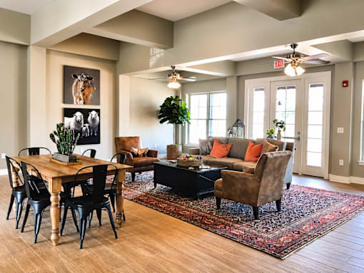 A living room with a wooden table and chairs.