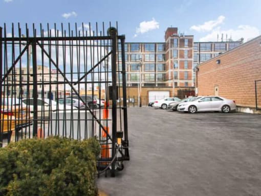 a parking lot with cars in front of a building