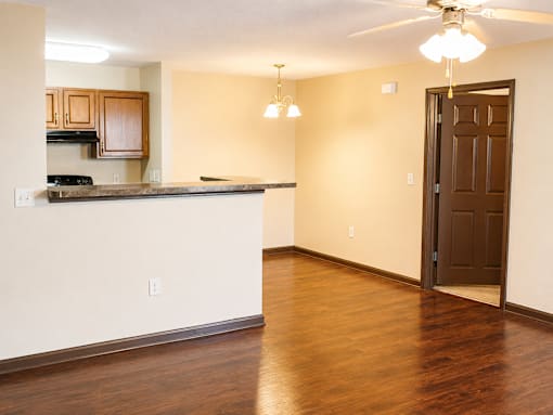 A kitchen with a counter and a door.