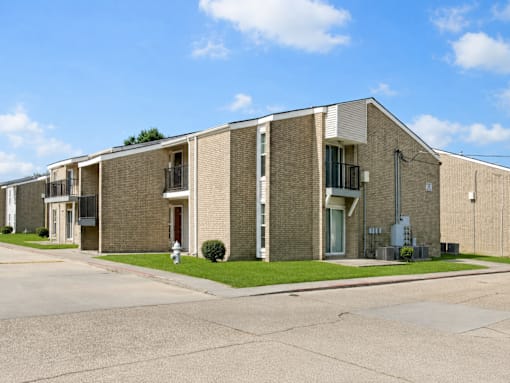 A row of houses with a clear blue sky above them.