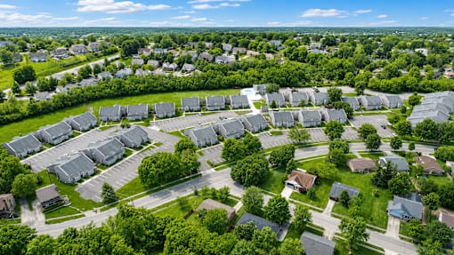 A bird's eye view of a residential area with houses and trees.