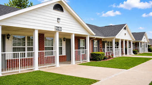 A row of houses with the first one having the number 114821 on the front.